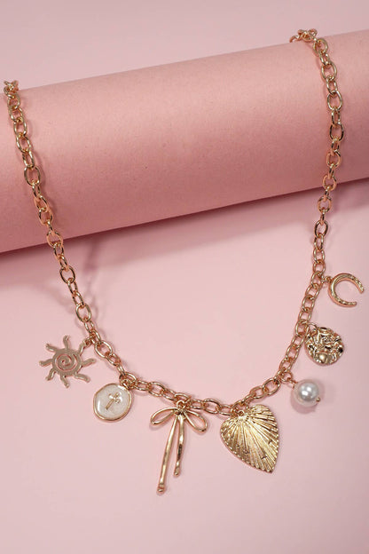 SUN BOW PEARL CROSS DISC U CHARM NECKLACE