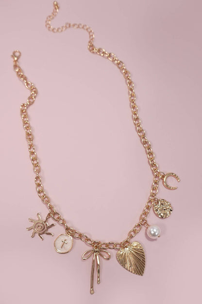 SUN BOW PEARL CROSS DISC U CHARM NECKLACE