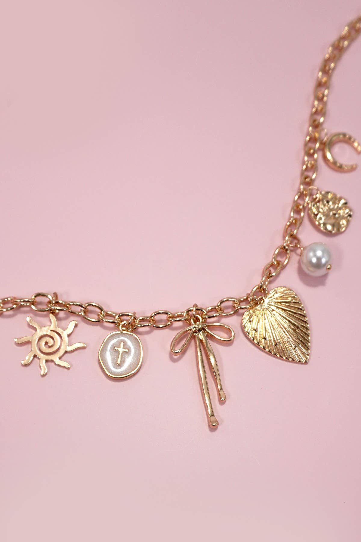SUN BOW PEARL CROSS DISC U CHARM NECKLACE